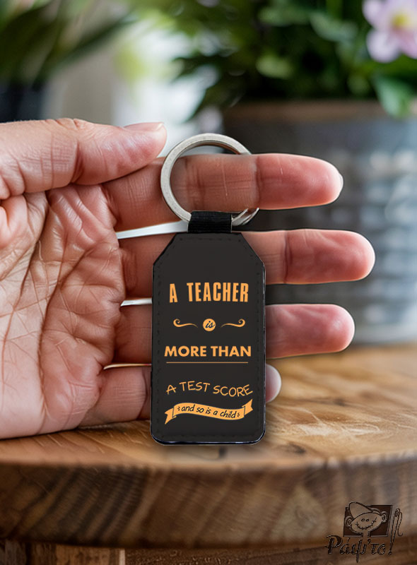 Key_ring_a_teacher_is Μπρελόκ με εκτύπωση - A Teacher Is More Than A Test Score - Image 1